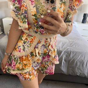 NWT! Luxxel multi color floral romper.